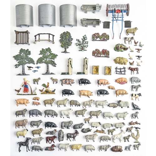 841 - A collection of William Britain's hollow cast and painted lead alloy farm animals, machinery, buildi... 