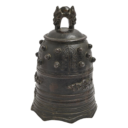 863 - A Japanese bronze bell, cast with kiku, uneven rich black patina, 19cm h