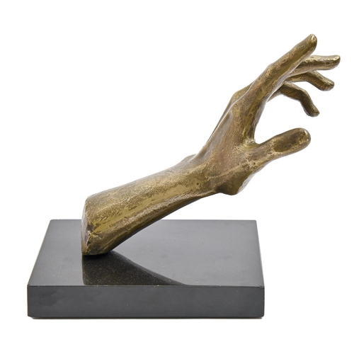 864 - A bronze sculpture of a right hand, 20th c, on polished black marble base, 14cm h