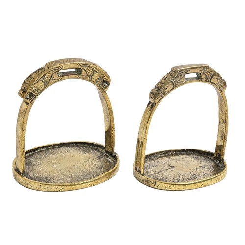 866 - Two South East Asian brass stirrups, 19th c, 15.5 and 16cm h