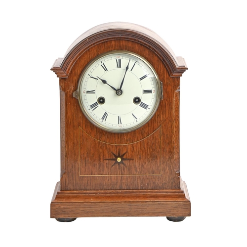 894 - An oak mantel clock, early 20th c, with enamel dial and Gustav Becker gong striking movement, pendul... 