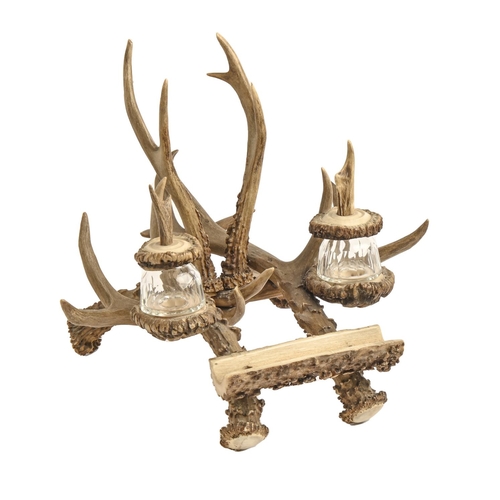 355 - An antler inkstand, with pen rest and two covered, faceted glass inkwells, 25cm h