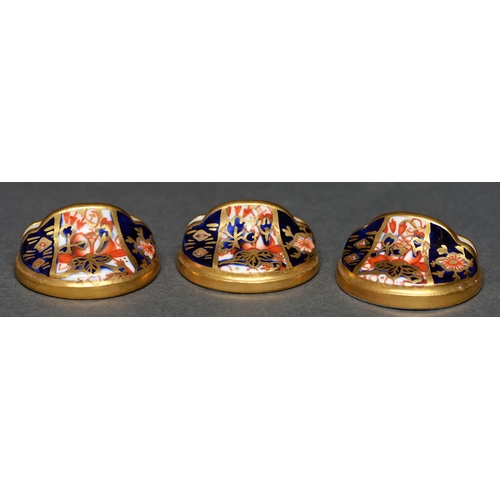 159 - A set of three Royal Crown Derby Witches pattern place or menu stands, c1930, 33mm diam, printed mar... 