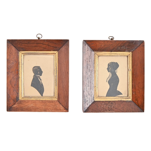 189 - A pair of 19th c silhouette of a lady and gentleman, in contemporary rosewood frames, 10 x 8cm... 