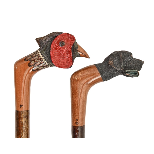 222 - Two walking sticks, James Purdey & Sons Ltd, London, the carved and painted wood handle as the h... 