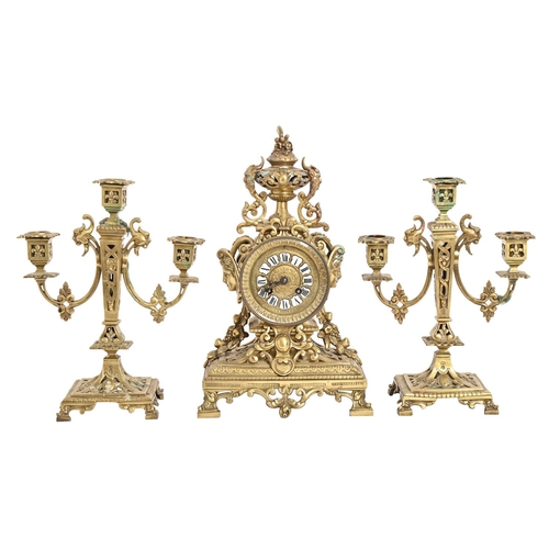 248 - A French brass garniture de cheminee, late 19th c, openwork design, the clock with drum cased moveme... 