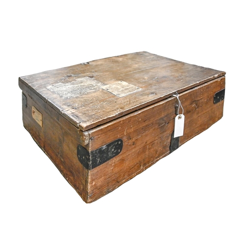 293 - A Victorian iron mounted pine box, with various labels, including Harrods Furniture Depository Barne... 