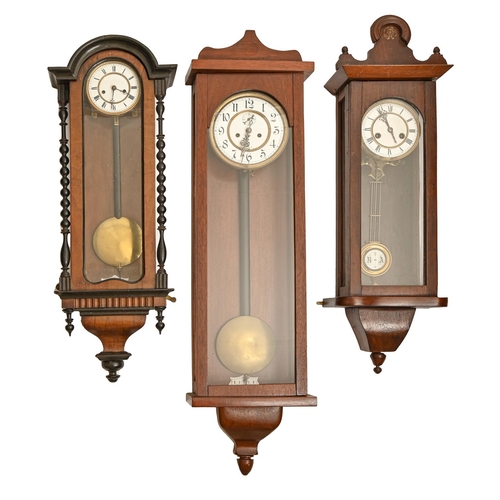 307 - Three Vienna wall clocks, c1900, walnut and ebonised or later associated cases, pendulums, walnut ex... 