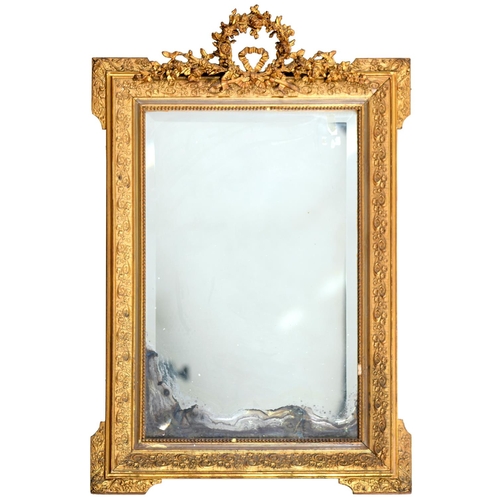 450 - A French giltwood and composition mirror, late 19th c, in Louis XVI style, the bevelled plate in rec... 