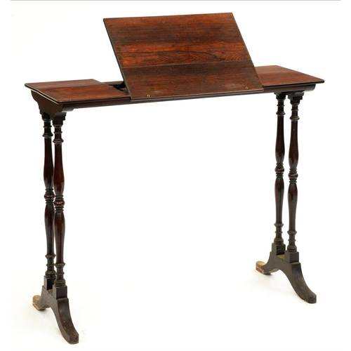 505 - A Victorian rosewood writing table, the narrow rectangular top with adjustable flap on coupled balus... 