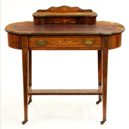 510 - A Victorian walnut and inlaid bow ended writing table, surmounted by a lidded stationery compartment... 