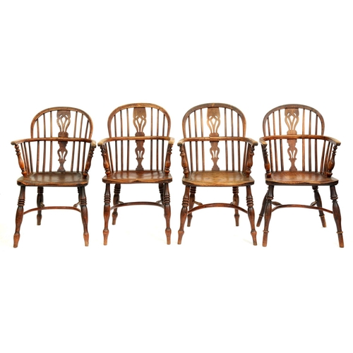 512 - Four Victorian yew wood Windsor chairs, East Midlands Region, with crinoline stretcher, three with e... 
