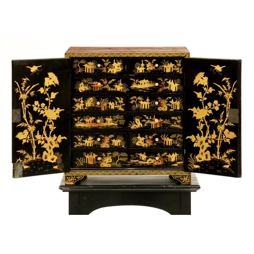 514 - A Chinese black and gold export lacquer table cabinet, early 19th c, the interior fitted with eight ... 