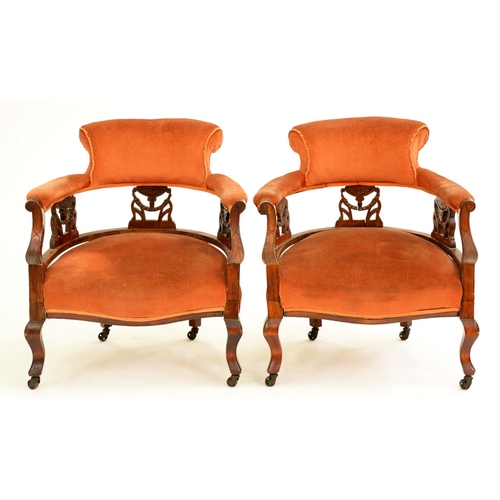 520 - A pair of Edwardian stained wood tub chairs, with carved splats