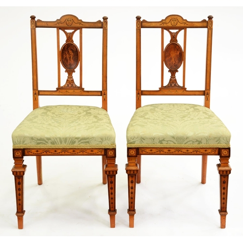 524 - A pair of Edwardian carved and inlaid satinwood chairs, T H Filmer & Son London, decorated with ... 
