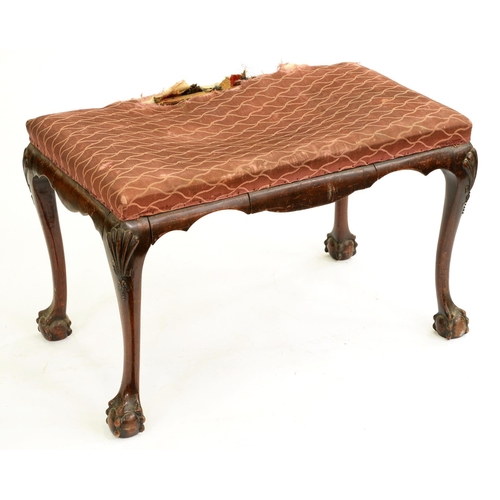 527 - A walnut stool, early 20th c, on carved cabriole legs and claw and ball feet, 52cm h; 45 x 81cm... 