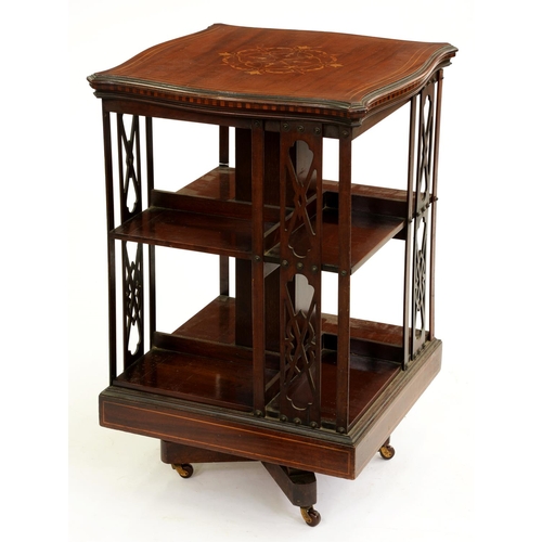 533 - An Edwardian serpentine mahogany and inlaid rotating bookcase, 82cm h; 53 x 53cm