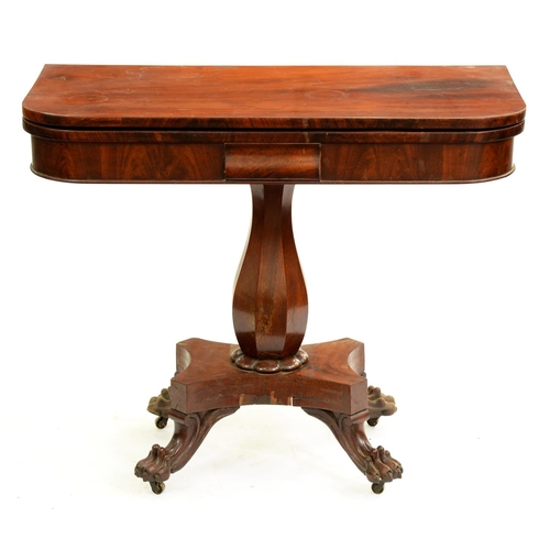 539 - An early Victorian mahogany card table, with octagonal baluster pillar, platform and carved paw feet... 