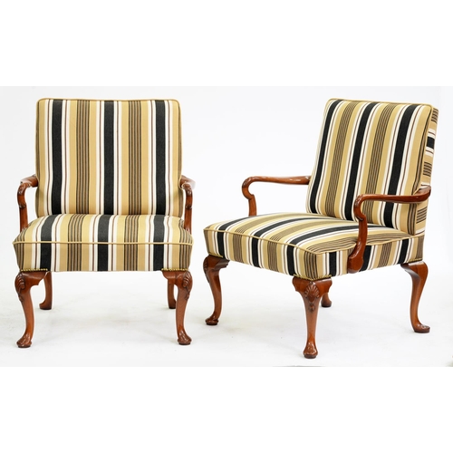 552 - A pair of walnut library armchairs of unusually large proportions, late 20th c, in George II style, ... 