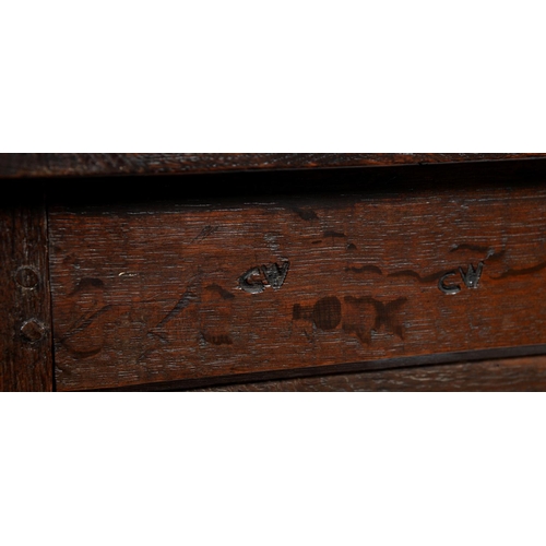 554 - An oak chest, early 20th c, with panelled lid and front, carved frieze and stiles, 59cm h; 51 x 125c... 