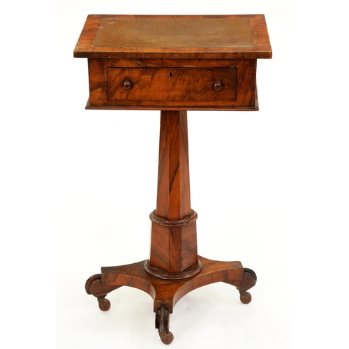 568 - A Victorian walnut pedestal writing table, with adjustable top, drawer and ink drawer, on octagonal ... 