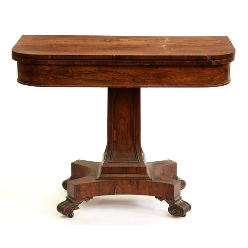 581 - A William IV rosewood card table, on panelled pillar, platform and volute feet, with castors, 75cm h... 