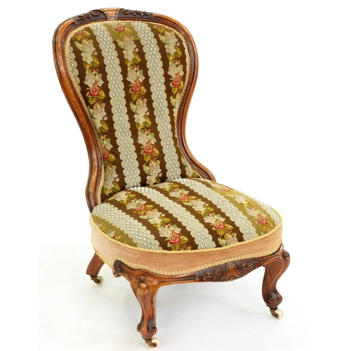 603 - A Victorian carved walnut nursing chair, in contemporary floral striped Berlin woolwork and beadwork... 