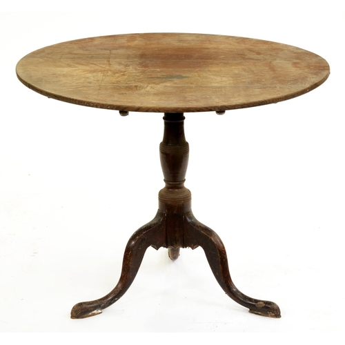 651A - A George III oak tripod table, 73cm h; 92cm diam