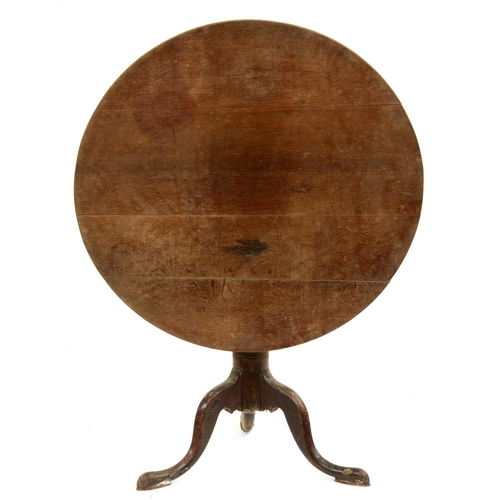 651A - A George III oak tripod table, 73cm h; 92cm diam