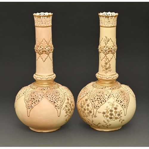 66 - A pair of Grainger's Worcester reticulated vases, 1899, decorated in raised gilding with foliage on ... 