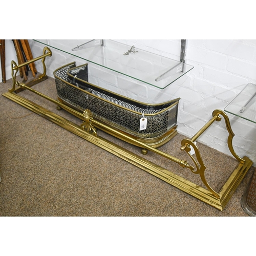 832 - A Victorian brass fender, 163cm x 36cm and two later pierced brass fenders, 80cm w and smaller... 