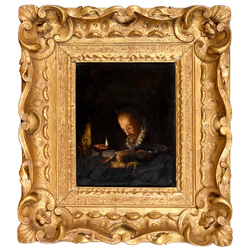 434 - Dutch School - Reading by Lamplight, indistinctly signed (on the document), oil on panel, 19.5 x 15.... 