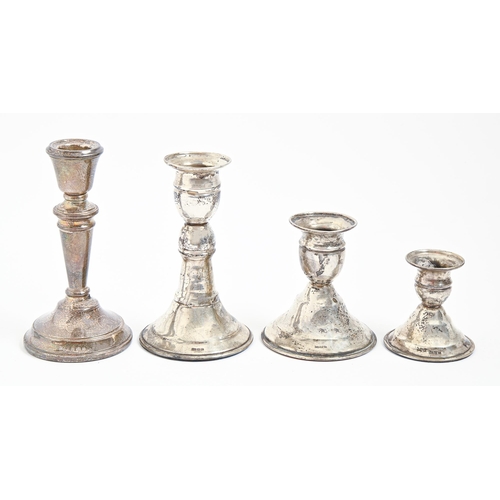 232 - Four Elizabeth II and other 20th c dwarf silver candlesticks, 6-13cm h, loaded