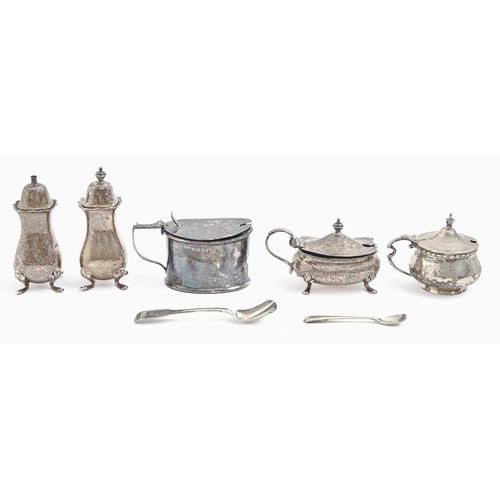 241 - A George V three-piece silver condiment set and two mustard pots, blue glass liners, pepperette 95mm... 