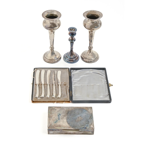 256 - A pair of silver vases, early 20th c, 22cm h, marks rubbed, loaded, a silver candlestick, Chester 19... 