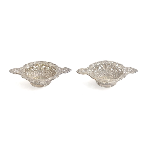 264 - A pair of Victorian die stamped silver sweetmeat dishes, 10.7cm over handles, maker's mark rubbed, B... 