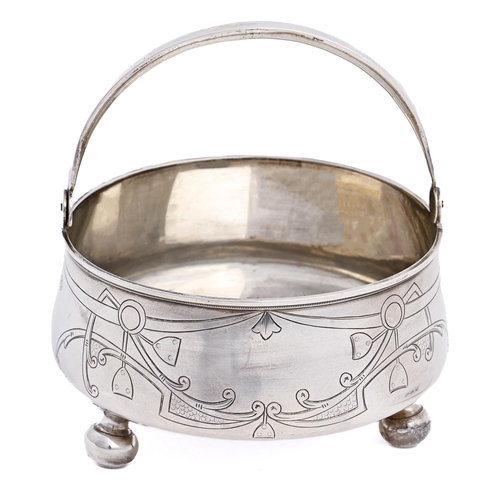 285 - A Russian silver sugar basket, with swing handle, on ball feet, 11.5cm diam, by Vasily Sikachef, Mos... 