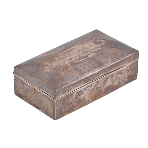 292 - A George V silver cigarette box, cedar lined, the lid engraved Presented to F H Wynne Esquire by Ilk... 