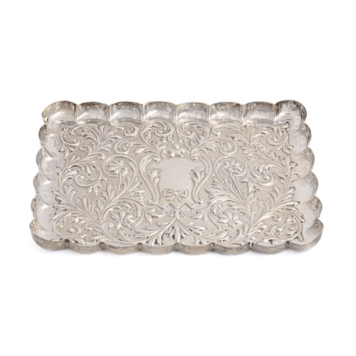 300 - A Victorian die stamped silver dressing table tray,  with scalloped rim, 23cm l, by Mappin &... 