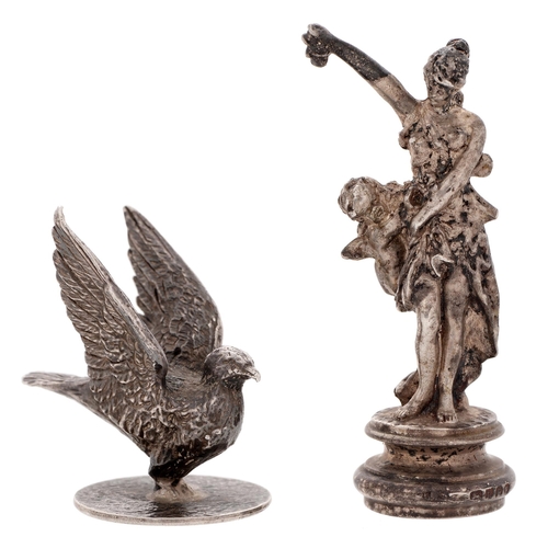 332 - A German cast silver figural standing seal in the form of a maiden teasing Cupid, early 20th c, 65mm... 