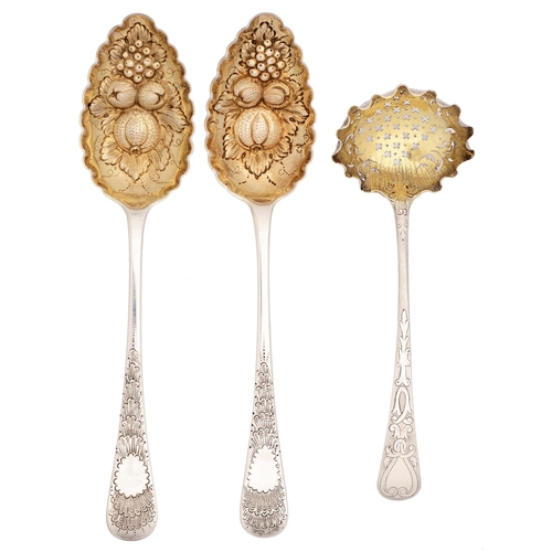 334 - A pair of George III silver tablespoons and a sauce ladle, later chased and gilt as berry spoons, th... 