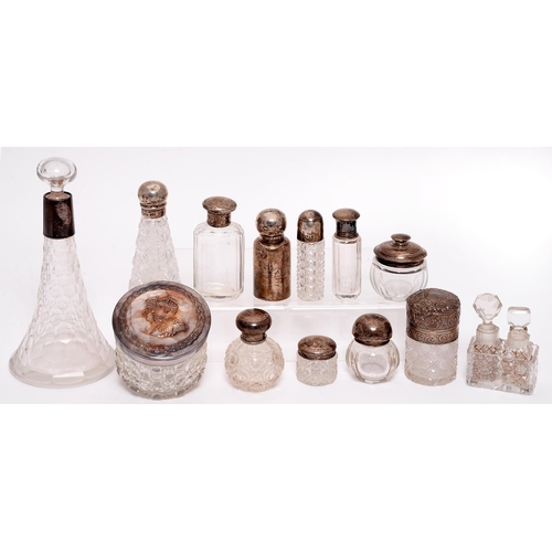 372 - Miscellaneous silver and silver mounted glass jars and bottles, c1900, the plated example embossed w... 