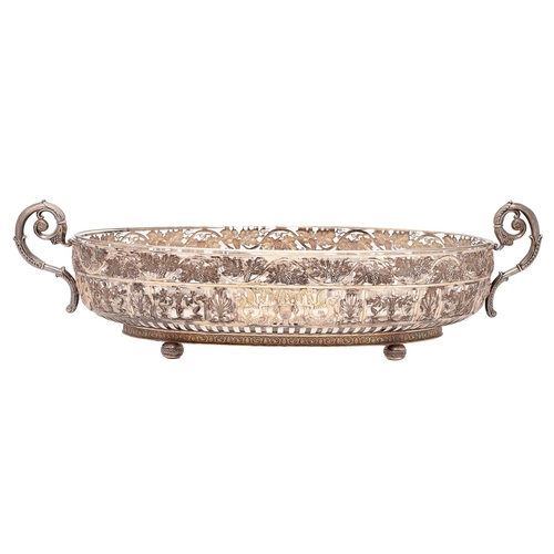 379 - A German silver centrepiece, the two handled oval openwork bowl with grapevine border above panels o... 