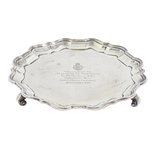 394 - A George V silver salver, with Bath border, on three volute feet, crested, 20.5cm diam, by Mappin &a... 