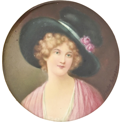 503 - An English porcelain plaque, c1900, painted by Leslie Johnson, signed, with a fair haired young woma... 