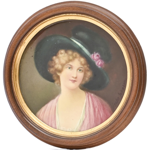 503 - An English porcelain plaque, c1900, painted by Leslie Johnson, signed, with a fair haired young woma... 