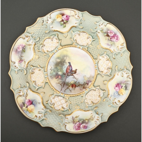 506 - A Royal Worcester moulded plate, 1903, printed and painted with pheasants and roses, 22cm diam,... 