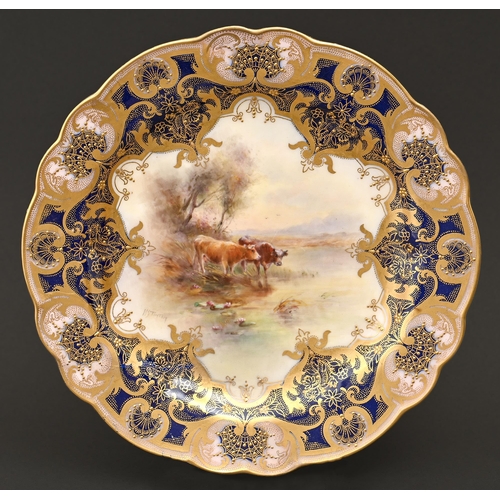 511 - A Royal Worcester plate, 1916, painted by H Stinton, signed, with cattle in blue and gilt border and... 