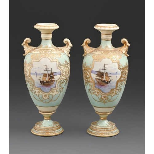 528 - A pair of Noritake vases, c1930, painted with seascapes reserved on a light blue ground, 24cm h, pri... 