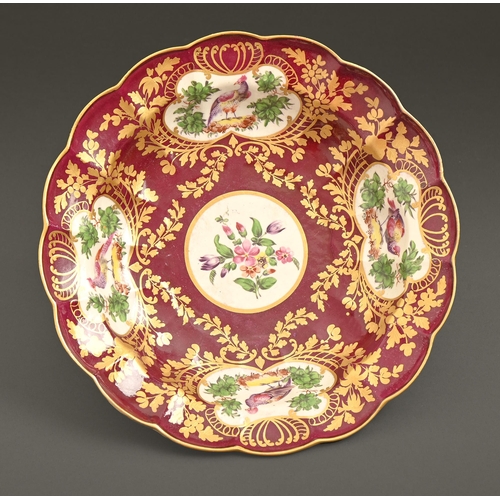 533 - A Worcester dessert dish, the porcelain c1775-80, the decoration later, painted with panels of birds... 